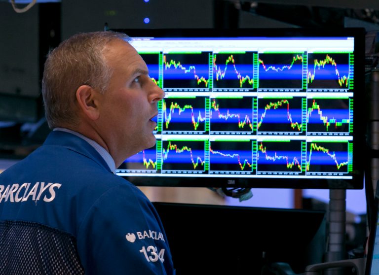 Specialist Geoffrey Friedman works at his post on the floor of the New York Stock Exchange, Tuesday, Aug. 5, 2014. The stock market fell to its lowest point since May as traders worried that tensions between Russia and Ukraine could flare up. (AP Photo/Richard Drew)
