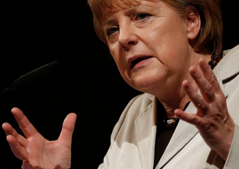   German Chancellor Angela Merkel gesticulates during her speech at the regional conference of her conservative party, in Darmstadt, central Germany, Saturday, June 16, 2012. German Chancellor Angela Merkel said Saturday she hopes Greeks will elect a new government that stands by the country's promises to international creditors, insisting that Europeans have to stop making commitments which they then ignore. Greeks vote Sunday for the second time in six weeks amid fears the country could be forced out of the euro if they reject strict austerity measures and structural reforms demanded in return for rescue loans by other European countries and the International Monetary Fund. Germany, Europe's biggest economy, has been a key advocate of that approach. (AP Photo/Mario Vedder)  