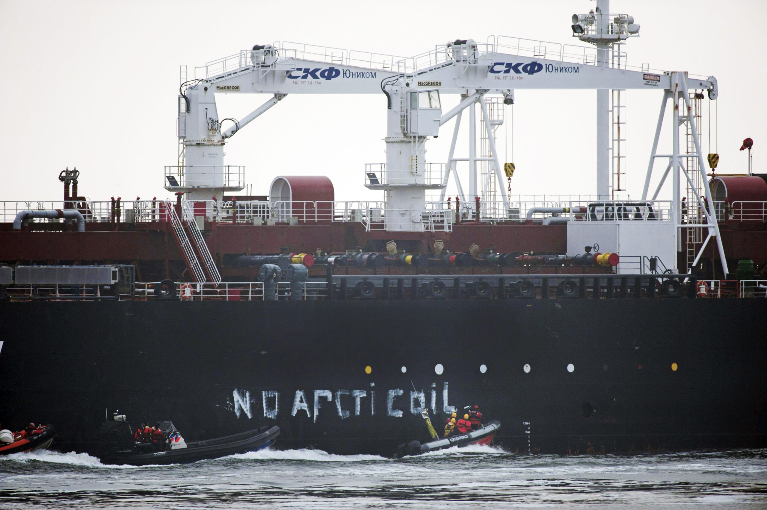 Police break Greenpeace blockade on Russian tanker