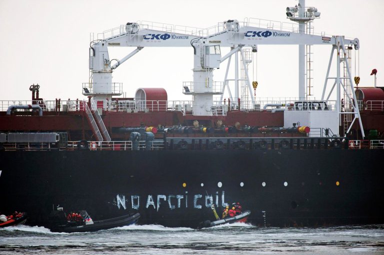 This image made available by environmental organization Greenpeace  shows Greenpeace activists aboard inflatable boats paint 'No Arctic Oil' on the side of the Mikhail Ulyanov oil tanker in Rotterdam, Netherlands, on Thursday, May 1, 2014. Greenpeace International activists are attempting to prevent a Russian tanker carrying the first oil from a new offshore platform in the Arctic from mooring at Rotterdam Port. The environmental group said Thursday it has sent two ships, Rainbow Warrior III and Esperanza, plus rubber rafts, paragliders and activists on shore, to meet the Mikhail Ulyanov, a tanker chartered by Russia's state-controlled oil company, Gazprom OAO. (AP Photo/Marten van Dijl, Greenpeace) NO SALES, NO ARCHIVE