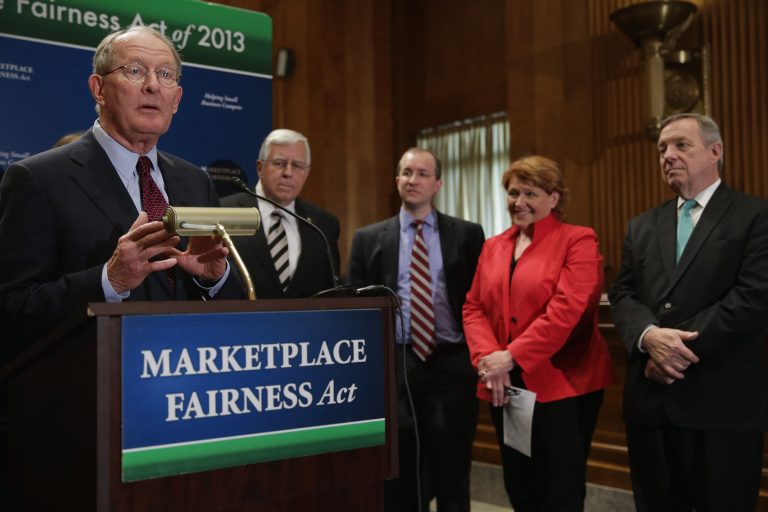 From left, Sen. Lamar Alexander (R-TN), Sen. Mike Enzi (R-WY), Peter Sides of the Robert M. Sides Family Music Center, Sen. Heidi Heitkamp (D-ND) and Senate Majority Whip Richard Durbin (D-IL) participate in a news conference about the previous introduction of the Marketplace Fairness Act on April 23, 2013. (Photo by Chip Somodevilla/Getty Images)