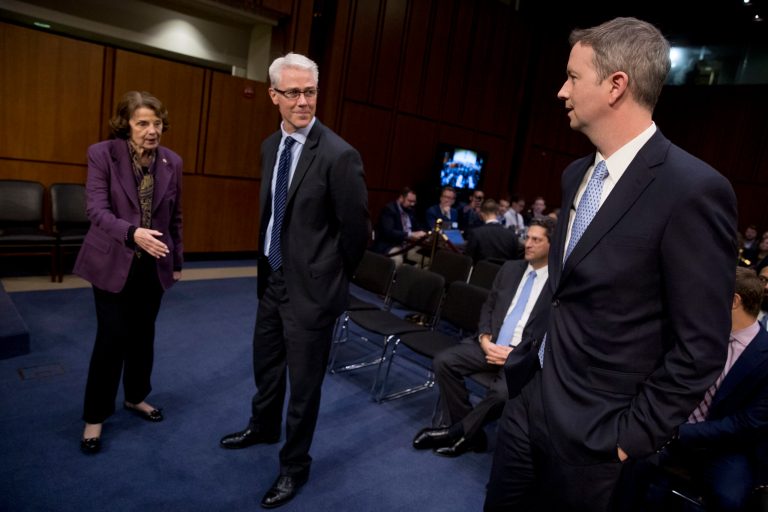 Sen. Dianne Feinstein, D-Calif., left, greets Facebook's General Counsel Colin Stretch, center, and Twitter's Acting General Counsel Sean Edgett, right, as they arrive for a Senate Committee on the Judiciary, Subcommittee on Crime and Terrorism hearing on Capitol Hill in Washington, Tuesday, Oct. 31, 2017, on more signs from tech companies of Russian election activity. (AP Photo/Andrew Harnik)