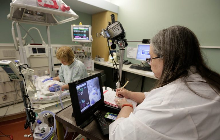 NIH awards grants to form pool of volunteers who will share genetic data to help scientists target cures. (AP Photo/M. Spencer Green)