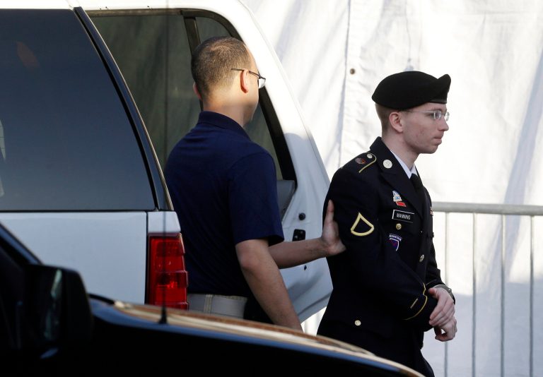 Army Pfc. Bradley Manning, right, is escorted from a security vehicle to a courthouse in Fort Meade, Md., Wednesday, April 10, 2013, before a pretrial military hearing. Manning, who is charged with causing hundreds of thousands of classified documents to be published on the secret-sharing website WikiLeaks, is scheduled to face a court martial in June. (AP Photo/Patrick Semansky)