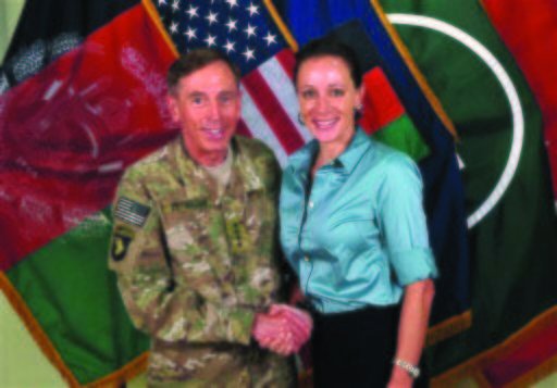 This July 13, 2011 file photo, made available on the International Security Assistance Force's Flickr website shows the former Commander of International Security Assistance Force and U.S. Forces-Afghanistan Gen. Davis Petraeus, left, shaking hands with Paula Broadwell, co-author of  