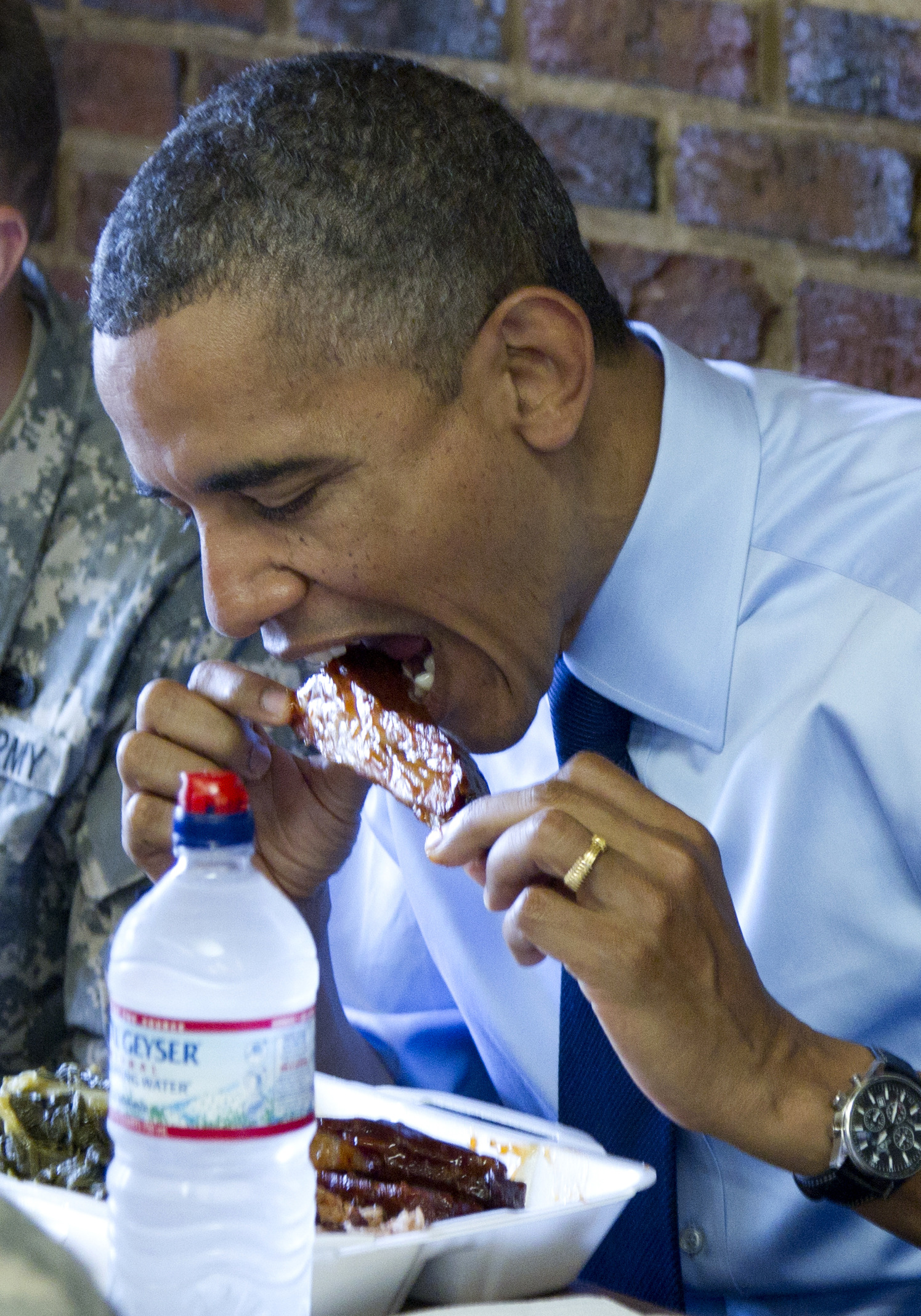 Obama honors dads, troops with ribs and greens
