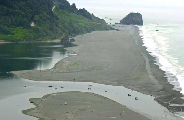 FILE - This July 23, 2002 file photo shows salmon fishermen filling the mouth of the Klamath River near Klamath, Calif. A federal judge, Wednesday, Aug. 27, 2014, has denied a request from irrigation suppliers in the Central Valley to stop emergency releases of reservoir water intended to protect Klamath River slamon from effects of the drought. (AP Photo/Rich Pedroncelli)