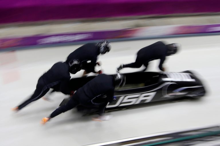The team from the United States USA-1, piloted by Steven Holcomb, start a run during the men's four-man bobsled training at the 2014 Winter Olympics, Friday, Feb. 21, 2014, in Krasnaya Polyana, Russia. (AP Photo/Dita Alangkara)