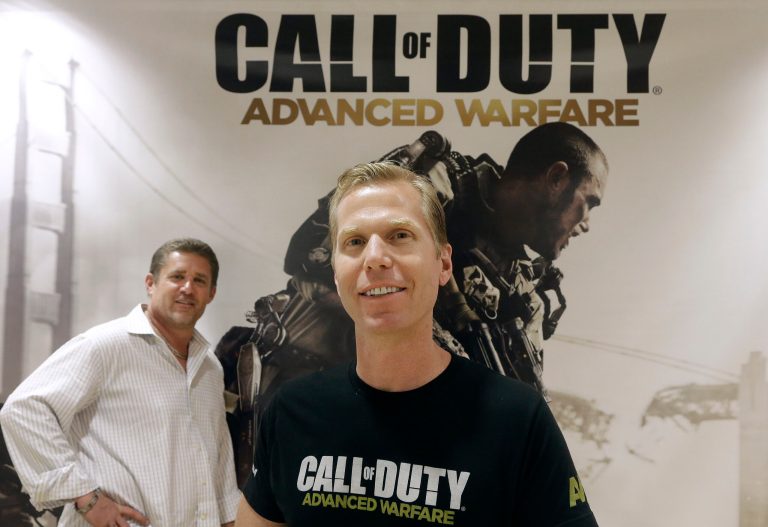 This July 31, 2014 shows Glen Schofield, left, and Michael Condrey, co-founders of Sledgehammer Games in front of a 