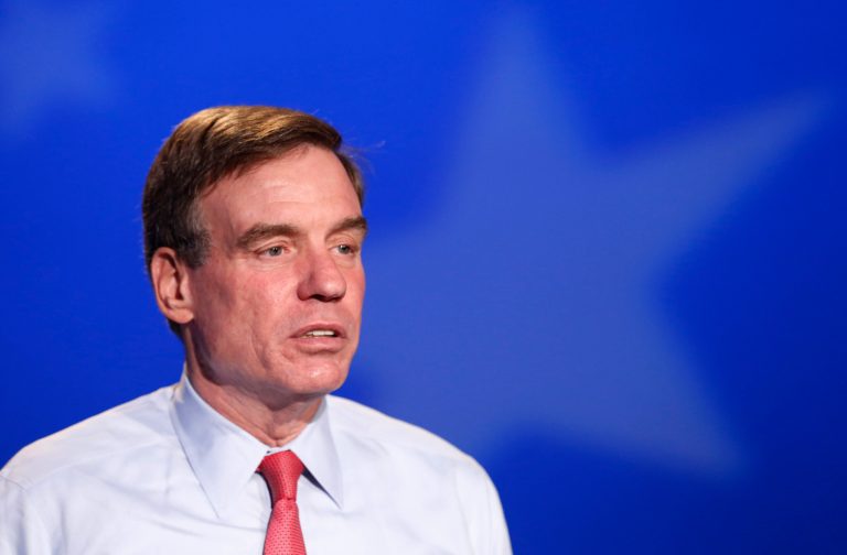 Sen. Mark Warner, D-Va., prepares for a debate in Richmond, Va., Monday, Oct. 13, 2014. (AP Photo/Steve Helber)
