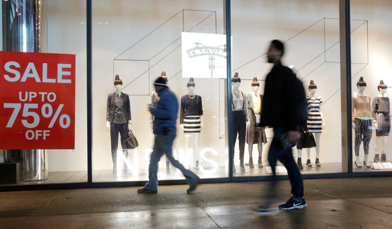 Economy grew at 4.1 rate in second quarter, best in nearly four years Pedestrians pass an H&M storefront window advertising discounts up to 75 percent in New York on Jan. 14, 2014.