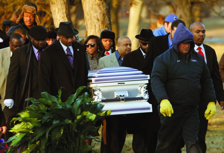 The remains of Hadiya Pendleton are taken to her final resting place at the Cedar Park Cemetery Saturday, Feb. 9, 2013, in Calumet Park, Ill. Pendleton was killed on Jan. 29, when a gunman opened fire on her and some friends seeking shelter in a park from the rain about a mile from President Obama's Chicago home. First lady Michelle Obama attended the funeral with Senior White House Adviser Valerie Jarrett and Secretary of Education Arne Duncan. (AP Photo/Charles Rex Arbogast)