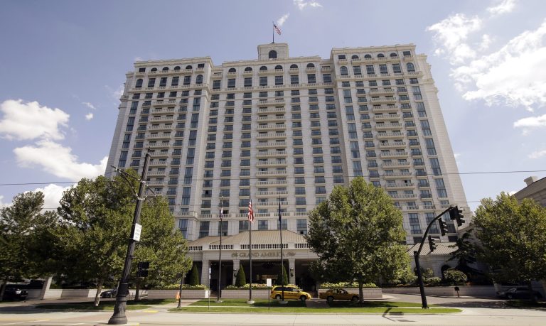 The Grand America Hotel is shown Wednesday, Sept. 10, 2014, in Salt lake City. The upscale hotel chain has agreed to pay about $2 million to settle allegations that 43 Utah employees working in the country illegally had returned to work after they were flagged by an immigration audit and fired, according to federal authorities.  (AP Photo/Rick Bowmer)