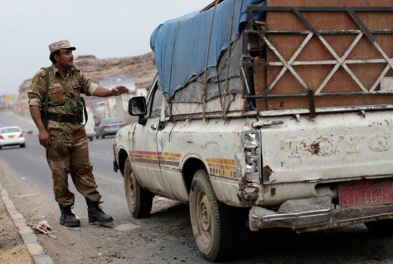   FILE - In this Sunday, Aug. 4, 2013 file photo, a Yemeni soldier stops a car at a checkpoint in a street leading to the U.S. embassy in Sanaa, Yemen. The U.S. military evacuated non-essential U.S. government personnel from Yemen on Tuesday, Aug. 6, 2013, due to the high threat of attack by al-Qaida that has triggered temporary shutdowns of 19 American diplomatic posts across the Middle East and Africa. (AP Photo/Hani Mohammed, File)  