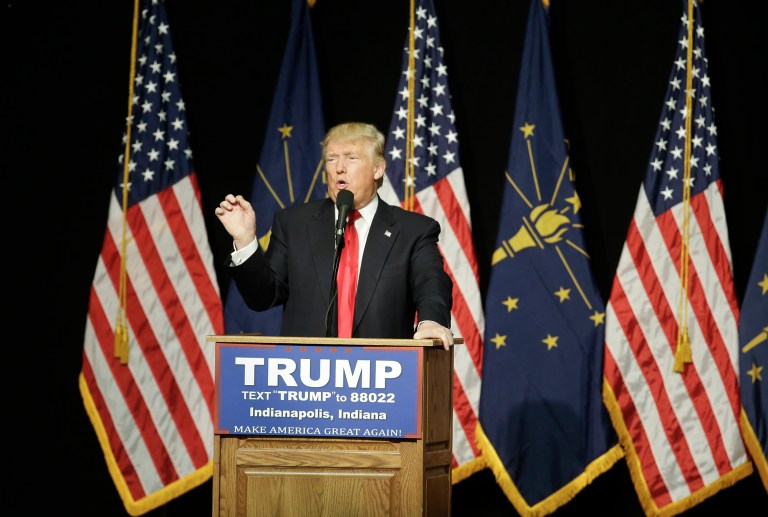 Republican presidential candidate Donald Trump on Thursday called on his GOP rivals Sen. Ted Cruz and Ohio Gov. John Kasich to get out of the race. (AP Photo/Darron Cummings)