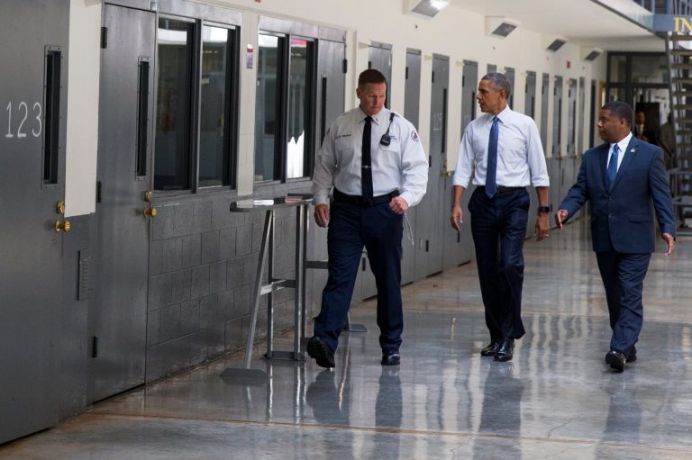 President Barack Obama is led on a tour by Bureau of Prisons Director Charles Samuels, right, and correctional officer Ronald Warlick during a visit to the El Reno Federal Correctional Institution, in El Reno, Okla., Thursday, July 16, 2015. (AP Photo/Evan Vucci)