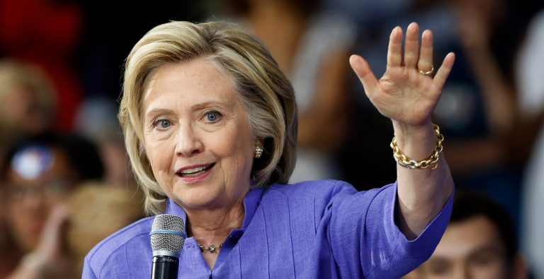 Democratic presidential candidate Hillary Rodham Clinton answers questions after announcing her college affordability plan, Monday, Aug. 10, 2015, at the high school in Exeter, N.H. (AP Photo/Jim Cole)
