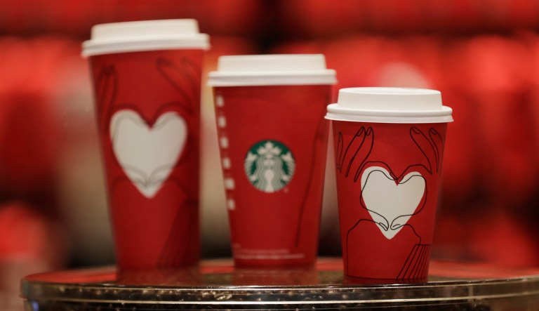 This photo shows Starbucks' cups with a new design at a Starbucks coffee shop in New York on Monday, Nov. 27, 2017. President Trump campaigned in 2015 and 2016 that he would end the 