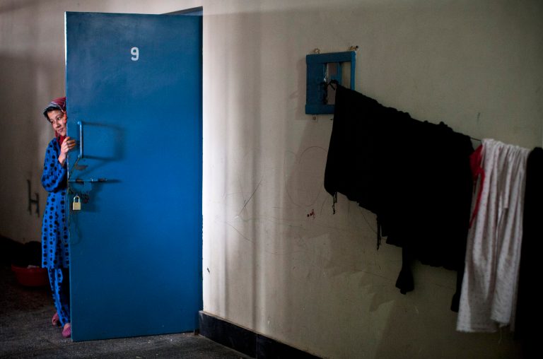 Picture taken March 28, 2013 shows an Afghan female prisoner outside her cell at Badam Bagh, Afghanistan's central women's prison, in Kabul, Afghanistan. Twohundred-and-two women living in the six- year- old jail, the majority of the women are serving sentences of up to seven years for leaving their husbands, refusing to accept a marriage arranged by their parents, or choosing to leave their parent's home with a man of their choice, all so-called 