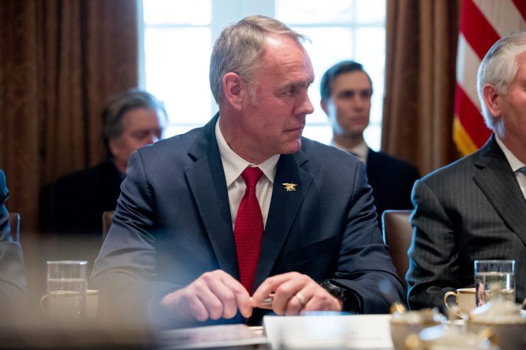 Interior Secretary Ryan Zinke attends a meeting with President Donald Trump and members of his Cabinet in the Cabinet Room at the White House, Monday, March 13, 2017, in Washington. (AP Photo/Andrew Harnik)