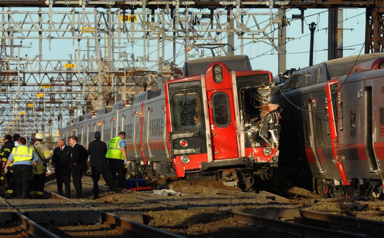 FILE - In this May 17, 2013 file photo, emergency workers arrive at the scene of a train collision in Fairfield, Conn. A track inspection found problems two days before a train derailed in the state and injured more than 70 people, the National Transportation Safety Board said Wednesday, June 5, 2013. The May 15 inspection found a rail joint with inadequate supporting ballast and indications of vertical movement of the track near the point of derailment, the NTSB said. The agency, which has been investigating the crash, said rail sections were shipped to a lab for further examination. (AP Photo/The Connecticut Post, Christian Abraham) MANDATORY CREDIT