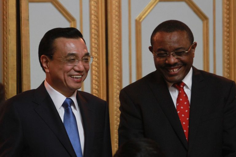 Chinese Premier Li Keqiang, left, is welcomed by Ethiopian Premier Hailemariam Desalegn at the Ethiopian Presidential Palace, in Addis Ababa, Ethiopia, Sunday May 4, 2014. Chinese Premier Li Keqiang has started his four-country tour of Africa with calls for deepening of ties between China and Africa. Li arrived in the Ethiopian capital of Addis Ababa Sunday and met with Ethiopian Premier Hailemariam Desalegn and signed a raft of trade agreements. (AP Photo/Elias Asmare)