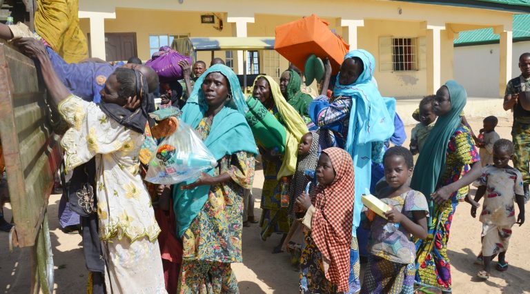 Women and children rescued by Nigerian soldiers from Boko Haram extremists in the northeast of Nigeria arrive at the military office in Maiduguri, Nigeria, Thursday, July 30, 2015. (AP Photo)Â 