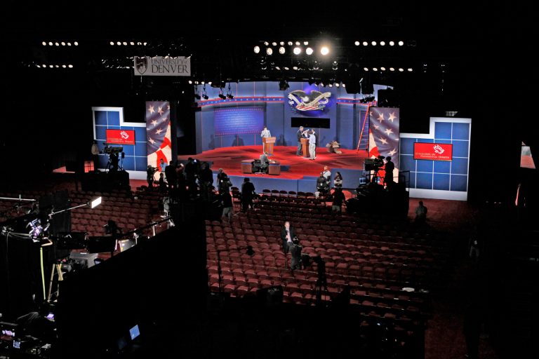 Crews work during a debate rehearsal at the University of Denver. (AP Photo)