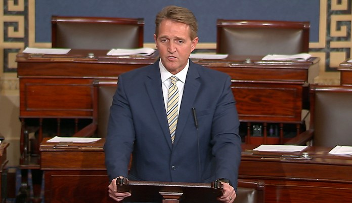 Sen. Jeff Flake, R-Ariz., called Trump's repeated attacks on the media "shameful" and "repulsive" and said Trump "has it precisely backward.'' Flake said despotism is the enemy of the people, while a free press is the despot's enemy and a guardian of democracy. (Senate TV via AP)