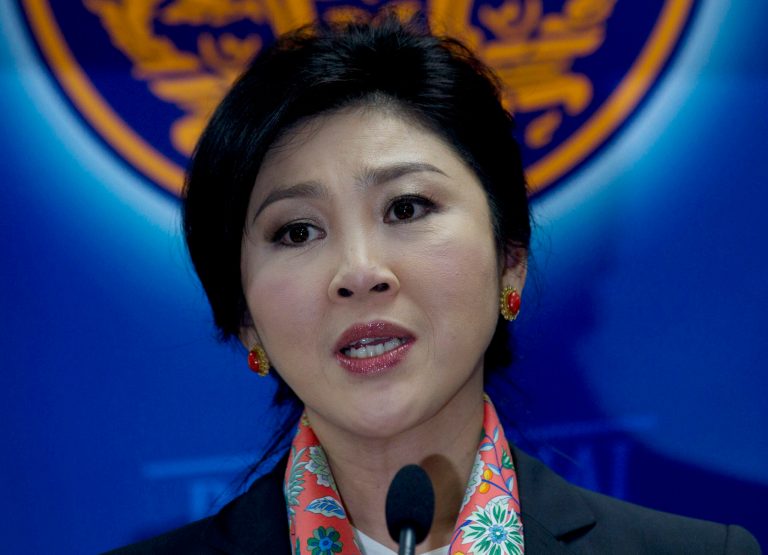 Thai Prime Minister Yingluck Shinawatra talks to media during press conference in Bangkok, Thailand Wednesday, May 7, 2014. Shinawatra and part of her Cabinet have been forced out of office by the Court ruling finding her guilty in an abuse of power case, pushing the country deeper into political turmoil. (AP Photo/Sakchai Lalit)