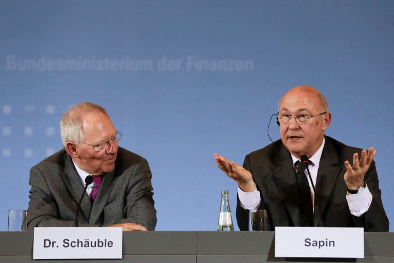 German Finance Minister Wolfgang Schaeuble, left, and his new counterpart from France Michel Sapin brief the media during a meeting at the Finance Ministry in Berlin, Monday, April 7, 2014. (AP Photo/Markus Schreiber)