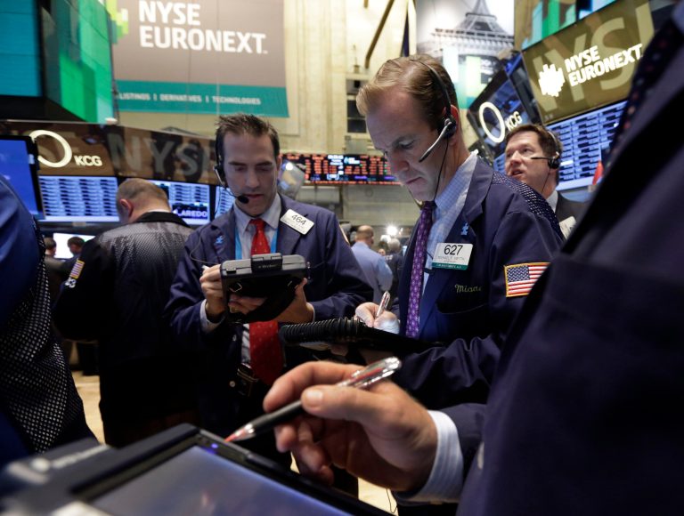 Traders work on the floor of the New York Stock Exchange on Tuesday. (AP/Richard Drew)