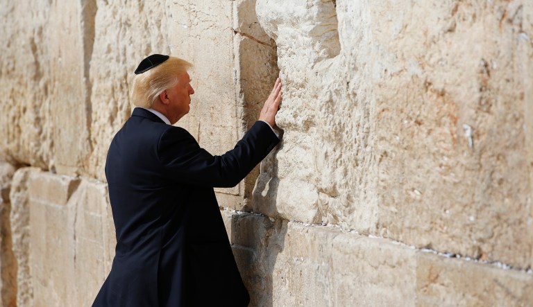 President Trump touches the Western Wall, Judaism's holiest prayer site, in Jerusalem's Old City Monday, May 22, 2017. Trump has announced the U.S. will recognize Jerusalem as the capital of Israel. (Ronen Zvulun, Reuters Pool via AP)