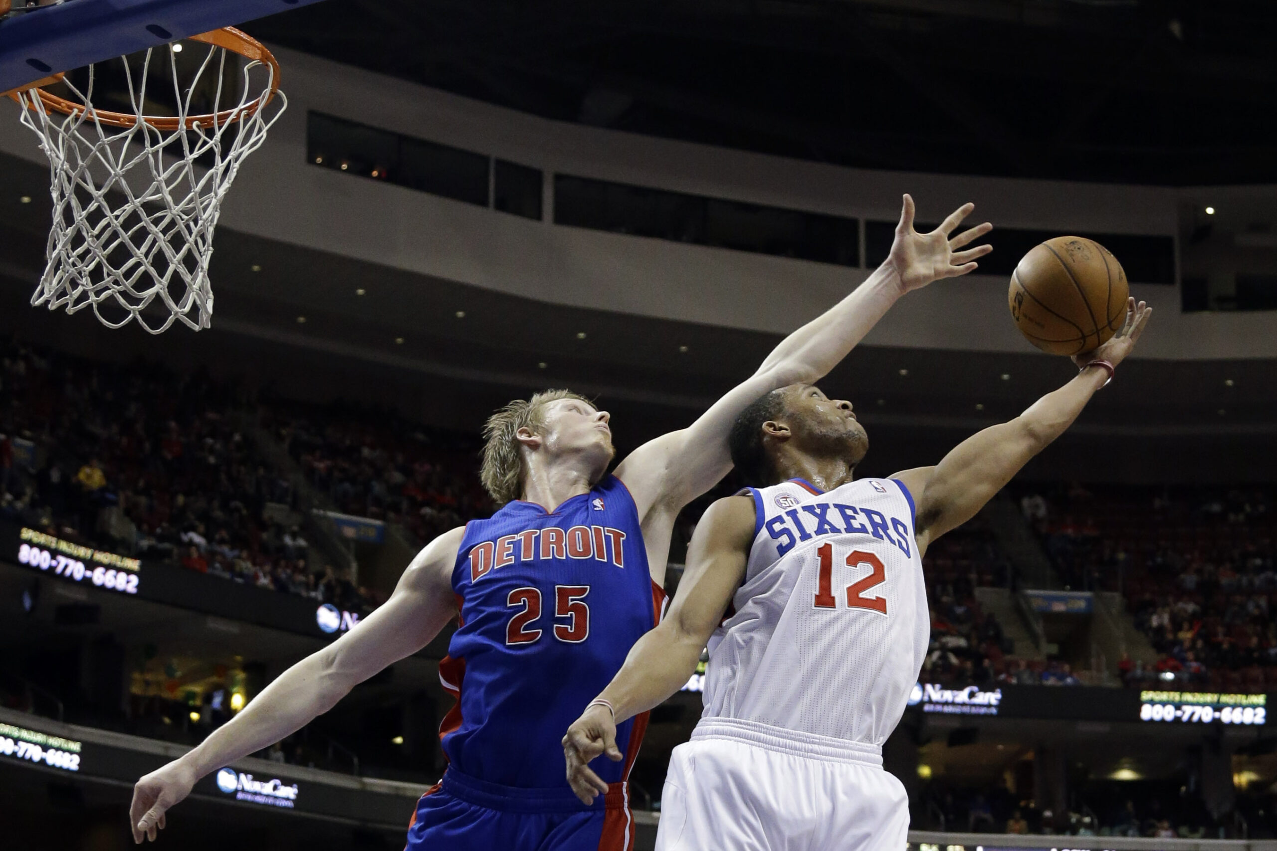 Holiday leads 76ers past Pistons 104-97
