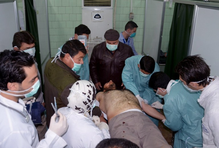 FILE - In this Tuesday March 19, 2013 file photo released by the Syrian official news agency SANA, a Syrian victim who suffered an alleged chemical attack at Khan al-Assal village according to SANA, receives treatment by doctors, at a hospital in Aleppo, Syria. The purported instances in which chemical weapons have been used in Syria have been relatively small in scale: nothing along the lines of Saddam Hussein's 1988 attack in Kurdish Iraq. That raises the question of who would stand to gain as President Bashar Assad's regime and the opposition trade blame for the alleged attacks and definitive proof remains elusive. Analysts say the answer could lie in the past the regime has a pattern of gradually introducing a weapon to the conflict to test the international community's response. (AP Photo/SANA, File)