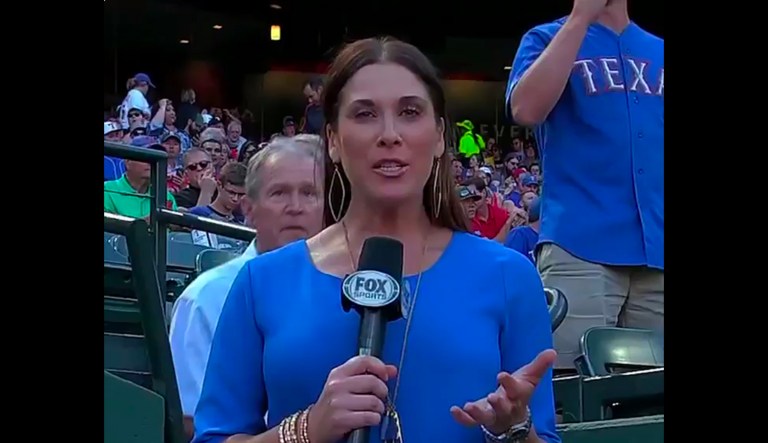 Former President George W. Bush photobombs Fox Sports Southwest's Emily Jones' report by walking by and apparently saying 