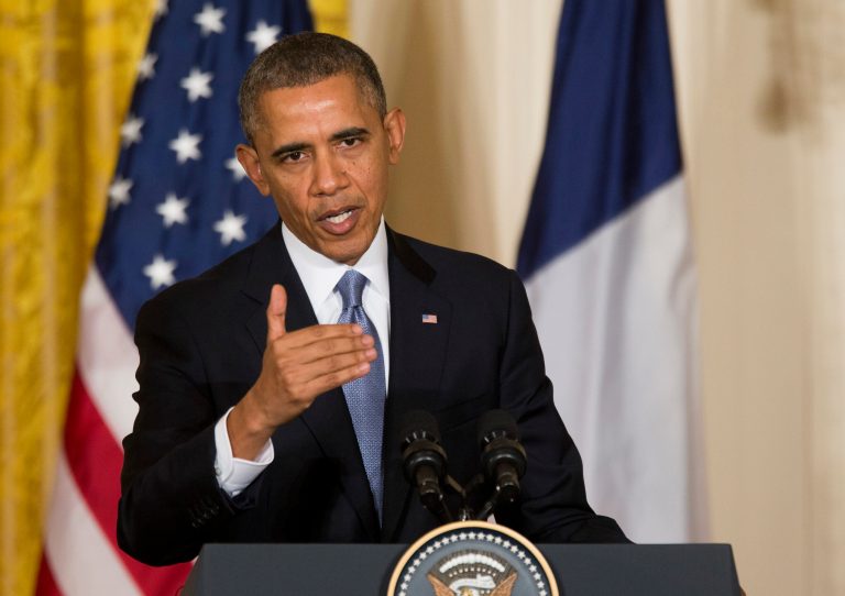 President Obama gestures during a joint news conference with French President FranÃ§ois Hollande, as part of an official state visit, Tuesday, Feb. 11, 2014, in the East Room of the White House in Washington. (AP Photo/J. Scott Applewhite)