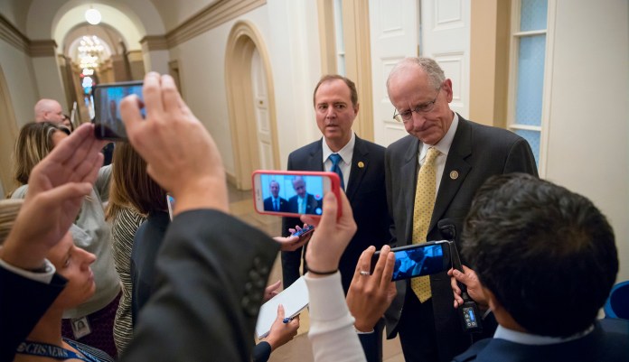 The leaders of the House Intelligence Committee, Rep. Adam Schiff, D-Calif., left, and Rep. Mike Conaway, R-Texas, emerge from a closed-door meeting. The committee voted unanimously to release the transcript "as quick as we can." (AP Photo/J. Scott Applewhite)