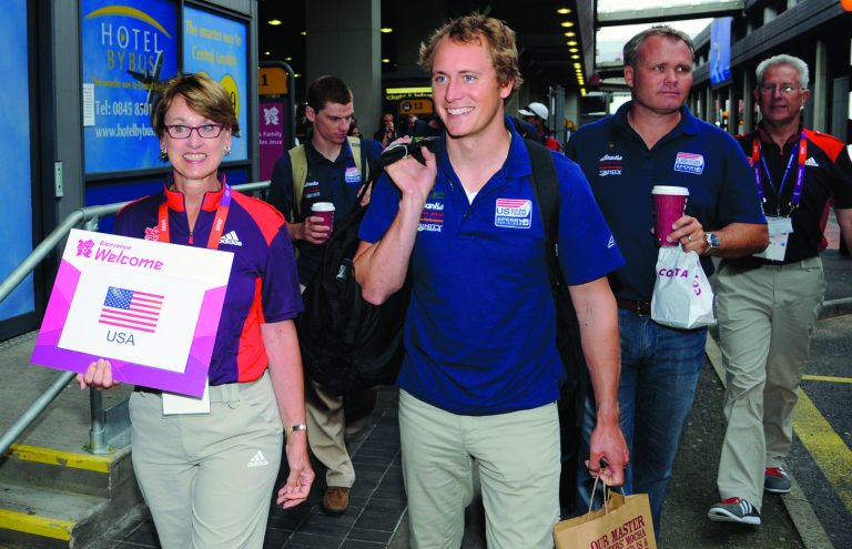 Members of the U.S. Olympic sailing team are escorted following their arrival at Heathrow Airport in London, Monday, July 16, 2012. Heathrow is set to welcome a record number of passengers Monday as athletes begin arriving for the London Olympics. (AP Photo) UNITED KINGDOM OUT, NO SALES, NO INTERNET, NO MAGS