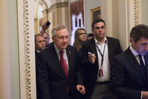 WASHINGTON, DC - DECEMBER 28: Senate Majority Leader Harry Reid (D-NV) ignores questions from reporters after meeting with U.S. President Obama and other Congressional leaders at the White House, as he walks to his office on Capitol Hill on December 28, 2012 in Washington, DC. The Senate was back in session on Friday to deal with the looming 