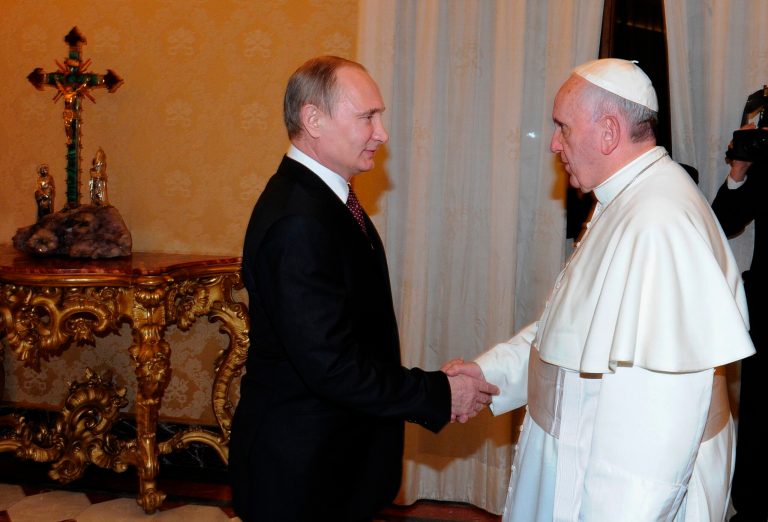 Pope Francis and Russian President Vladimir Putin shake hands during a meeting at the Vatican, Nov. 25, 2013. (AP Photo/RIA-Novosti, Mikhail Klimentyev, Presidential Press Service)