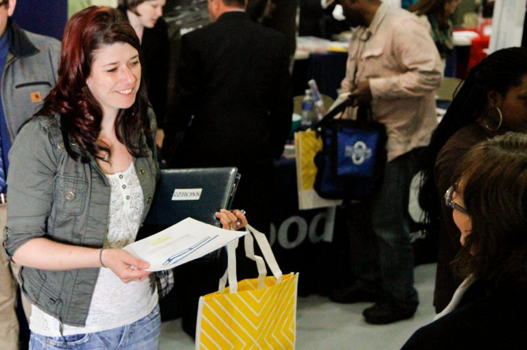 In this May 16, 2014 photo, Jessica Bowen, left, talks with Sandra Modena, Sales Manager at Trillium Staffing, at the annual veterans job fair aboard the LST in downtown Muskegon, Mich. The Labor Department issues its April report on job openings and labor turnover on Tuesday, June 10, 2014. (AP Photo/The Muskegon Chronicle, Madelyn Hastings) ALL LOCAL TV OUT; LOCAL TV INTERNET OUT