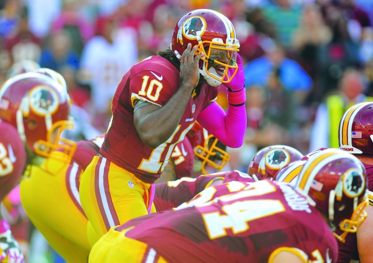 The booing in New York and Philadelphia could be so deafening that Robert Griffin III may not be able to hear the plays. (AP photo)