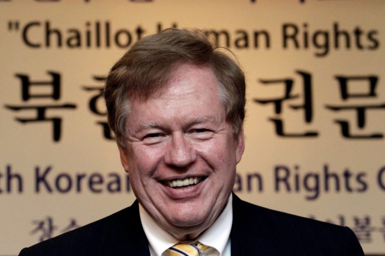   U.S. special envoy for North Korean human rights issues, Robert King, talks with participants during the Korea Institute for National Unificationâs International Conference on North Korean Human Rights in Seoul, South Korea, Thursday, June 14, 2012. The letters at a banner read 