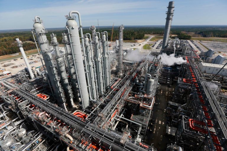 For big oil companies, a carbon tax gives them an edge over their primary competitor, coal. (AP Photo)