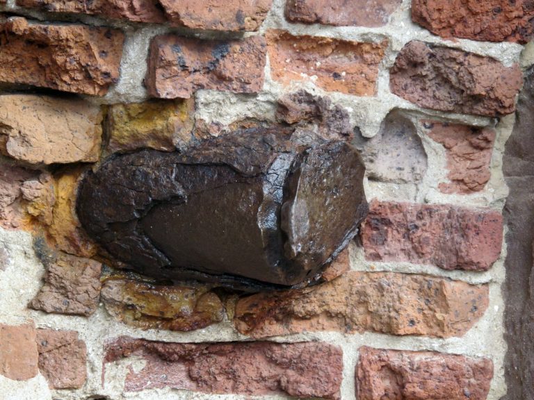   In this Dec. 11, 2012 photo, a shell from a Union Parrot gun is seen in a wall of a fort at Fort Sumter National Monument, S.C. The shells lodged in the fort where the Civil War began are being conserved in place because removing them would damage both the shells and the masonry around them. (AP Photo/Bruce Smith)  