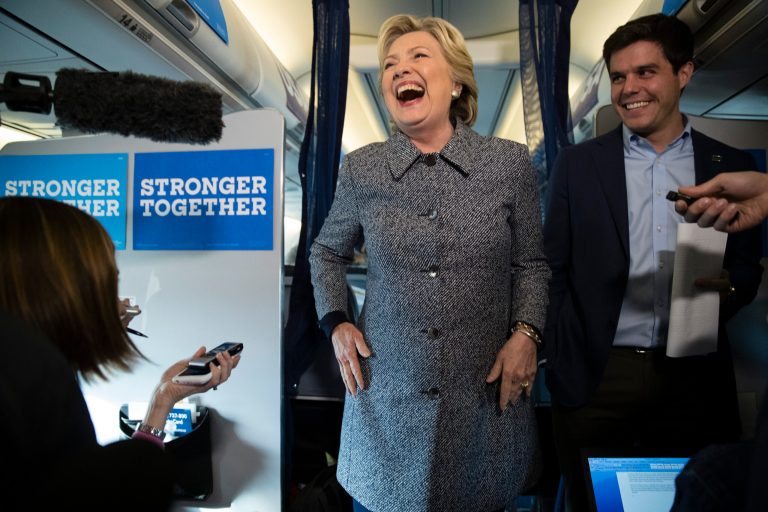 Democratic presidential candidate Hillary Clinton accompanied by traveling press secretary Nick Merrill speaks with members of the media on her campaign plane at Chicago Midway Airport in Chicago, Thursday, Sept. 29, 2016. (AP Photo/Matt Rourke)