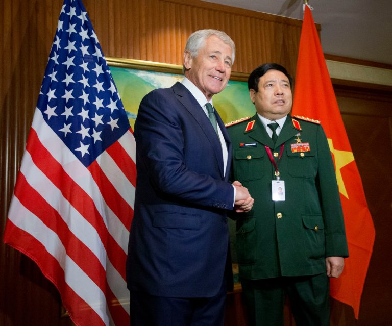 U.S. Defense Secretary Chuck Hagel, left, meets with Vietnam's Defense Minister Phung Quang Thanh, right, before the start of their meeting, Saturday, May 31, 2014 in Singapore. Hagel traveled to Singapore to attend the 13th Asia Security Summit. (AP Photo/Pablo Martinez Monsivais, Pool)