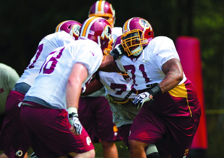 Evan Vucci/AP
Redskins left tackle Trent Williams, right, missed the last four games of the 2011 season because of a failed drug test.