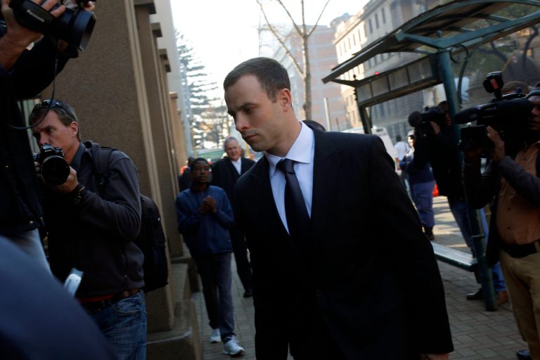 Oscar Pistorius arrives at court in Pretoria, South Africa, Tuesday, July 1, 2014. The murder trial resumed Monday June 30 after one month during which mental health experts evaluated the athlete and determined  he did not have  an anxiety disorder that could have influenced his actions on the night he killed his girlfriend Reeva Steenkamp. (AP Photo/Jerome Delay)